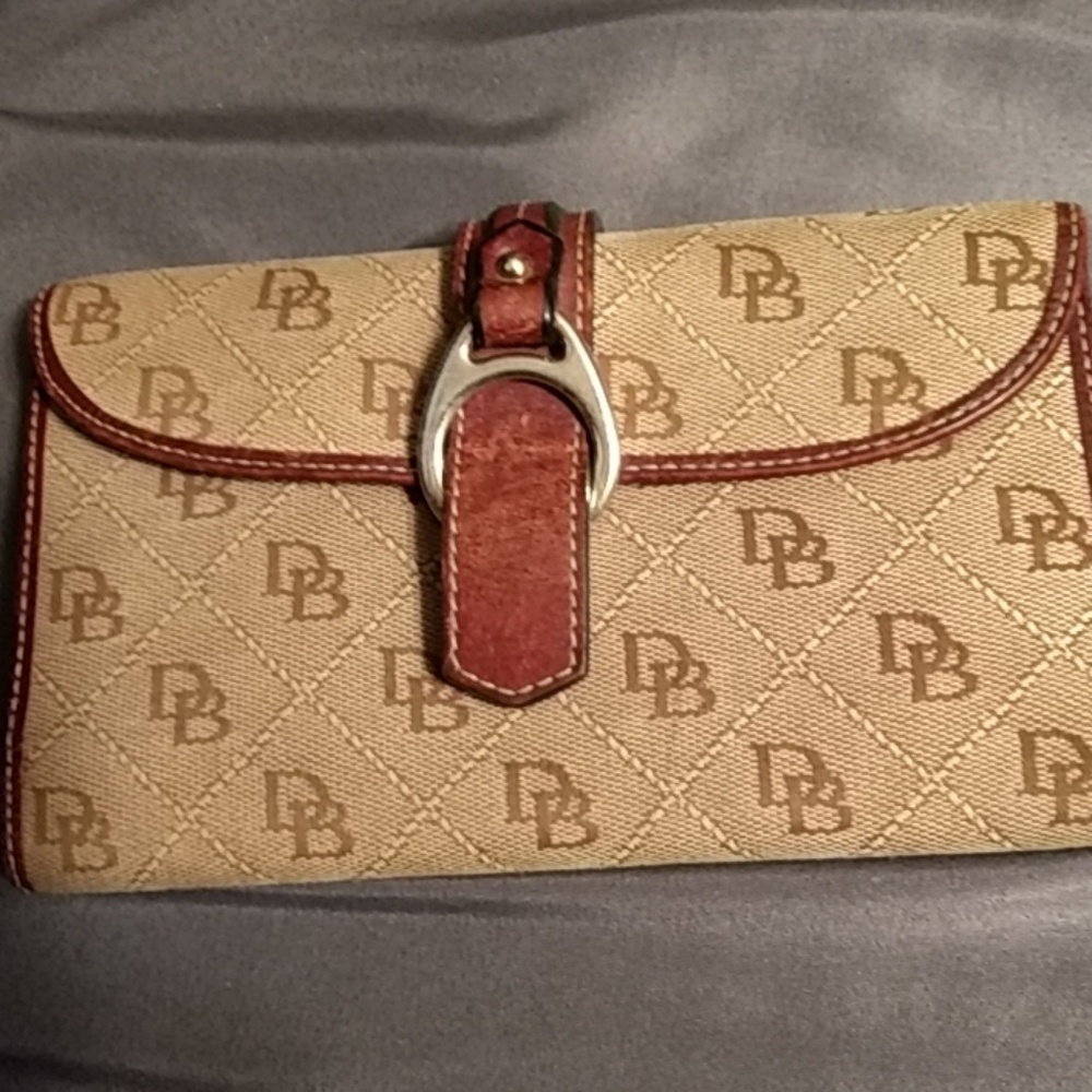 Dooney wallet used has some small scuffs on inside